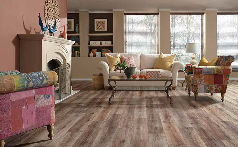 Trendy living room design with a mix of styles between the love seat and two chairs.